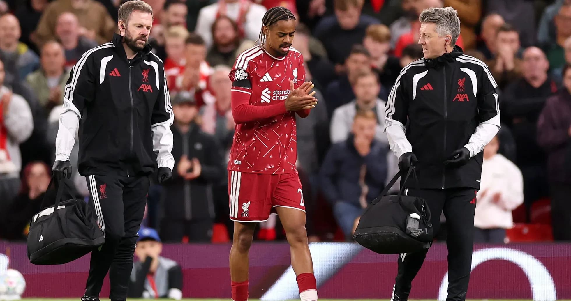 Liverpool player receiving medical attention on field Liverpool player receiving medical attention on field