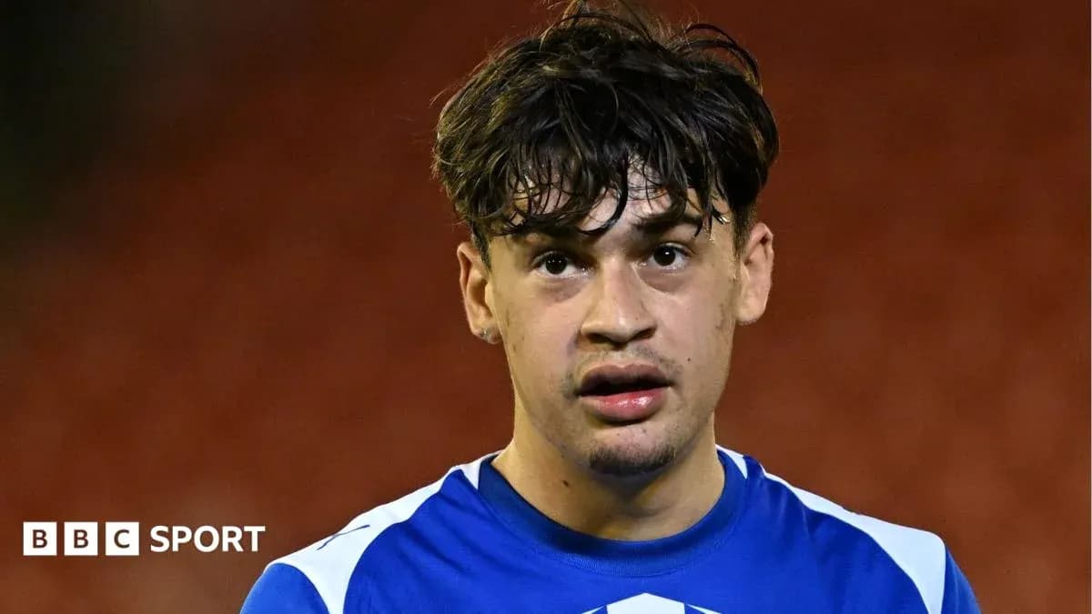 Football player in blue jersey after match Football player in blue jersey after match