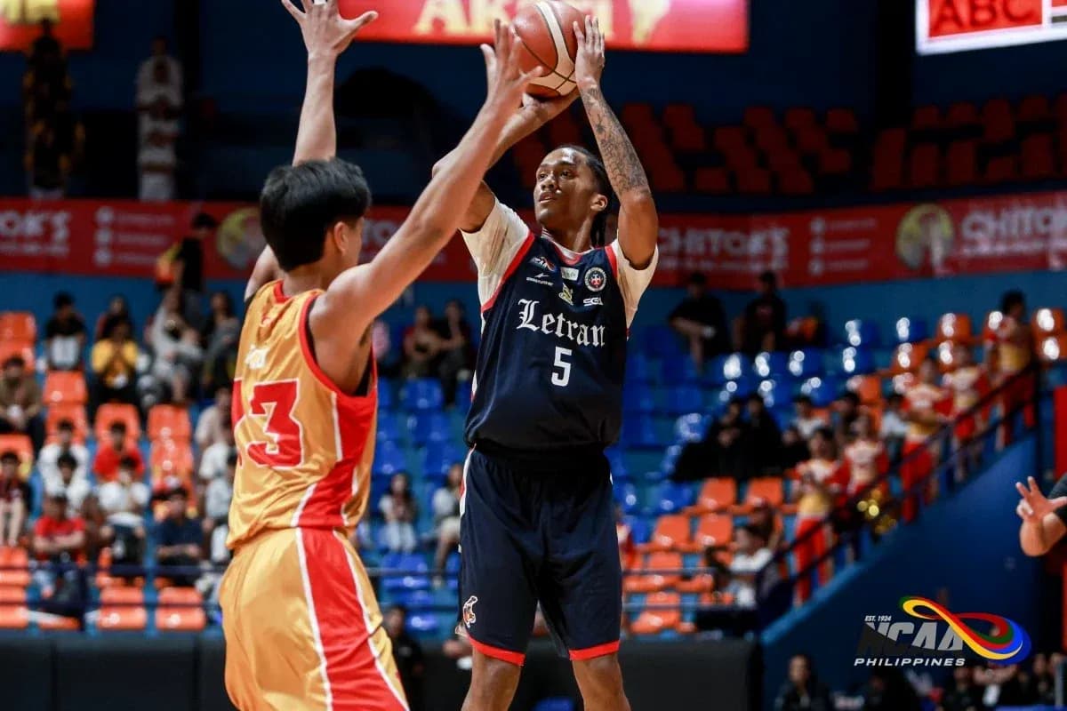 Player shooting basketball during a game Player shooting basketball during a game