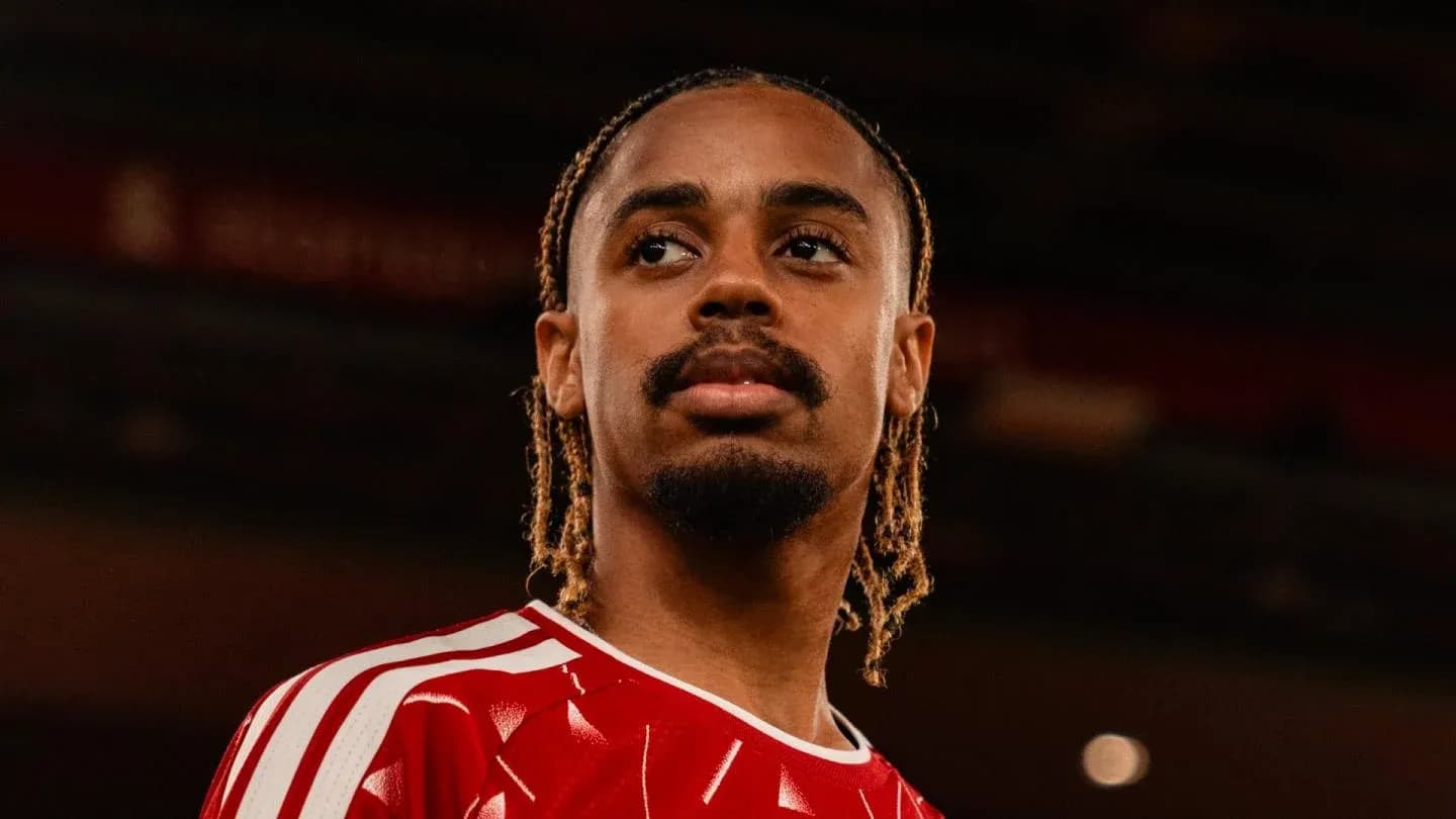 Player in red jersey posing for photo Player in red jersey posing for photo