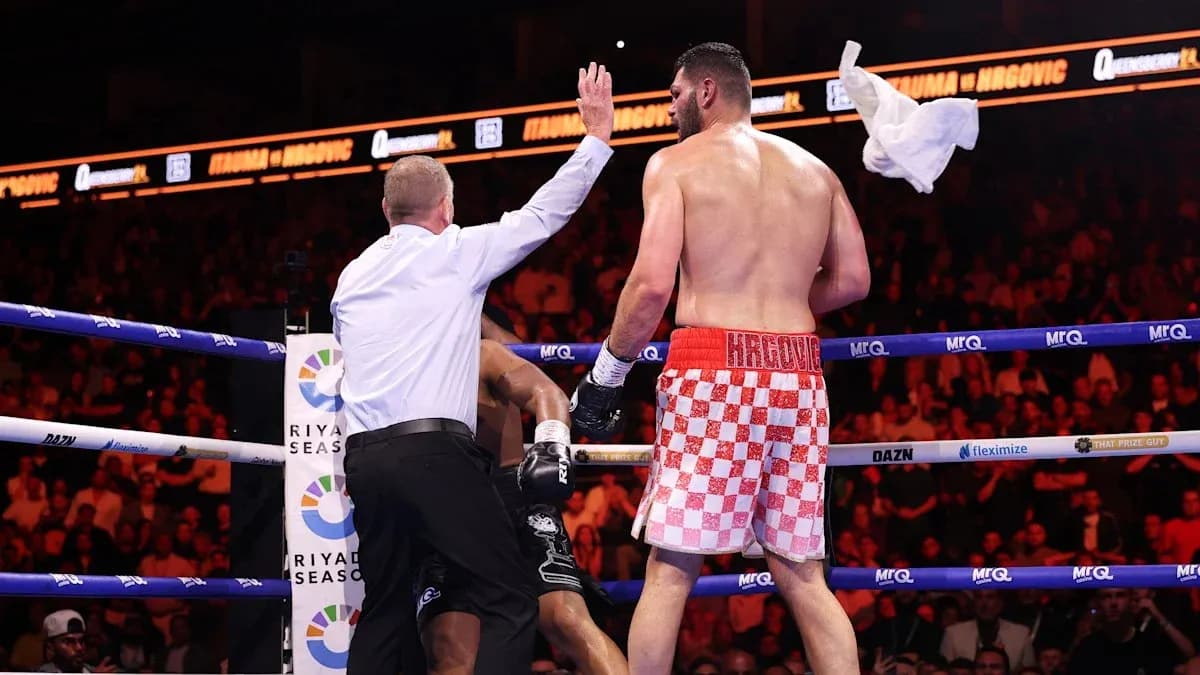 Referee stopping the boxing match with towel thrown Referee stopping the boxing match with towel thrown