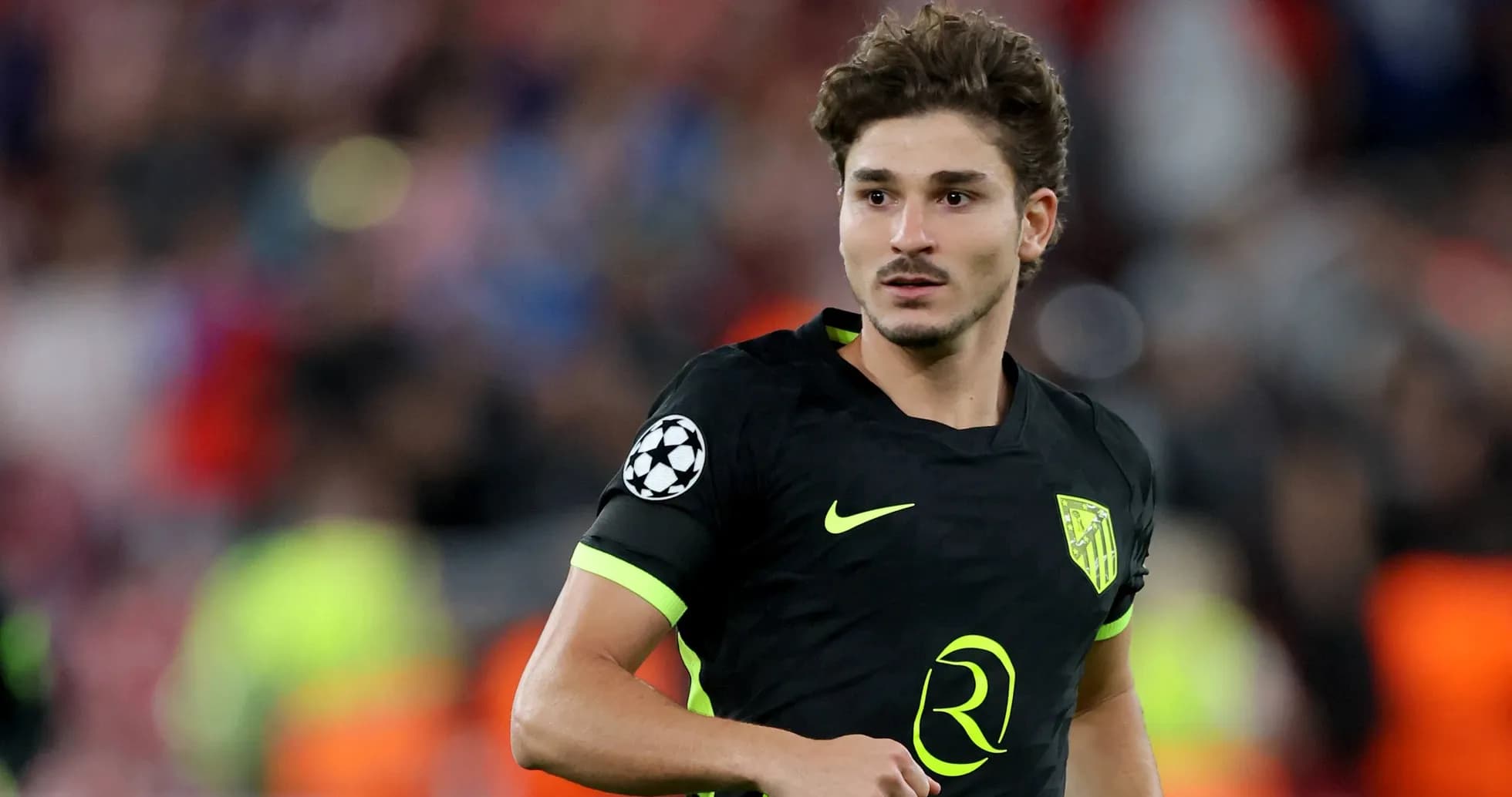 Player wearing Atletico Madrid kit on the pitch Player wearing Atletico Madrid kit on the pitch