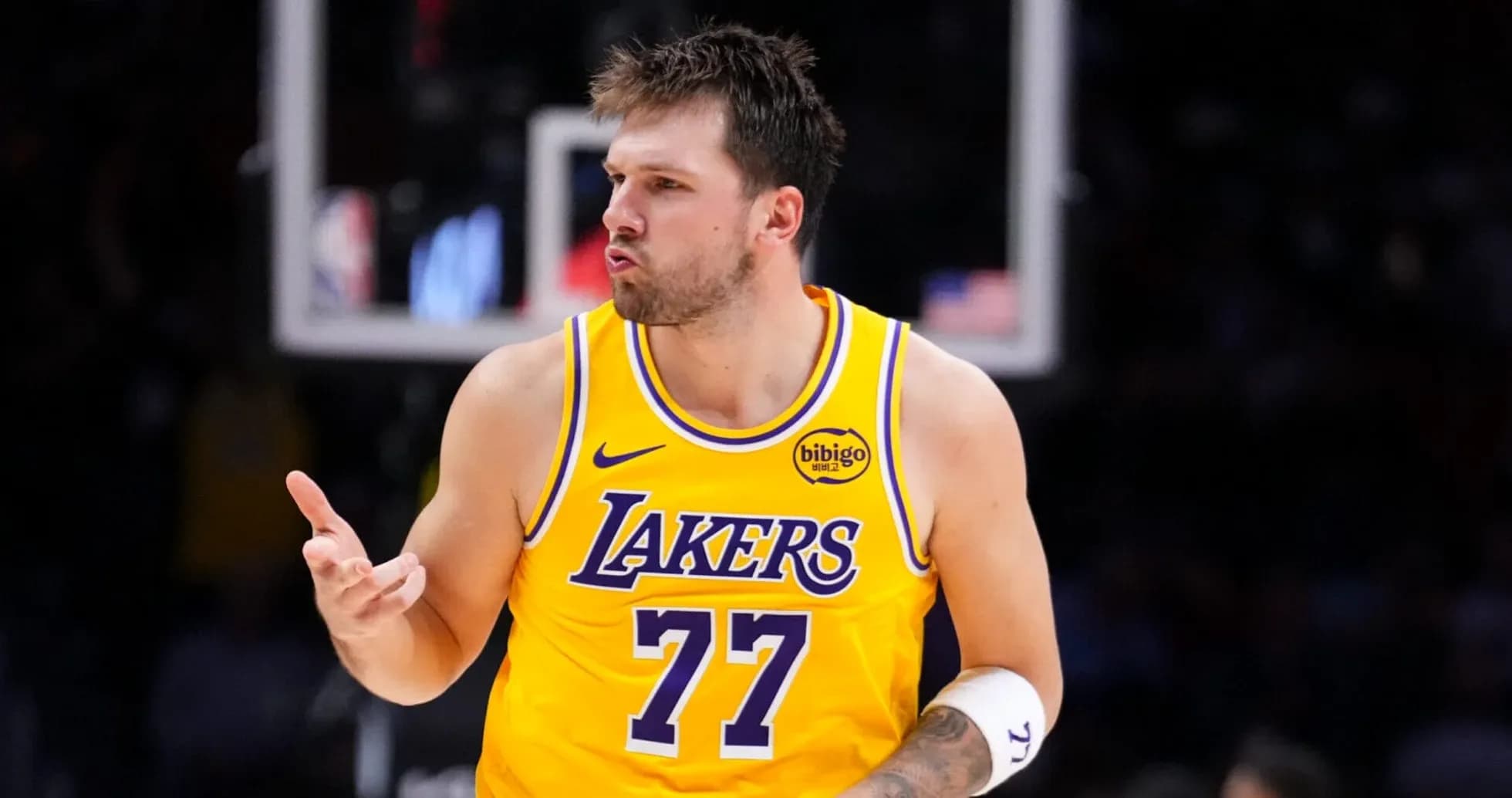 Player celebrating in Lakers jersey during game Player celebrating in Lakers jersey during game