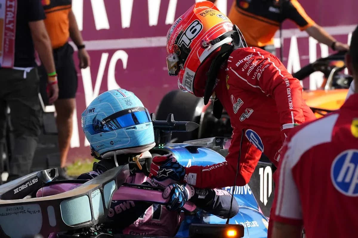Drivers interacting after a race incident in pit area Drivers interacting after a race incident in pit area