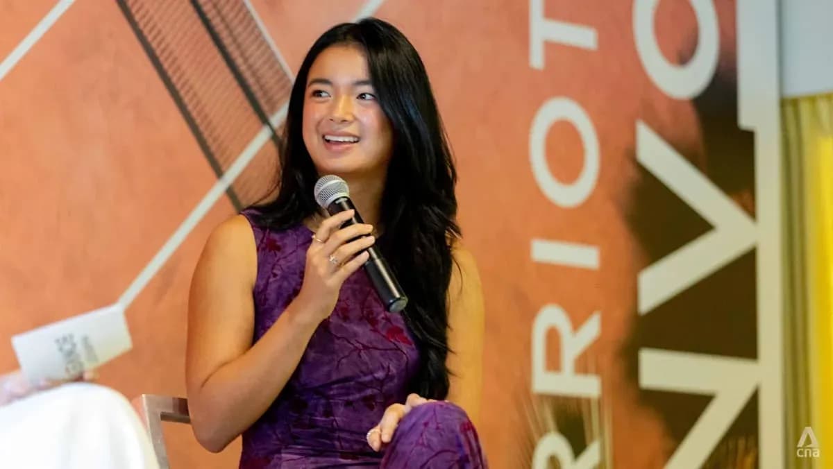 Young woman speaking into a microphone at event Young woman speaking into a microphone at event