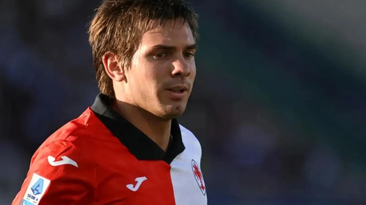 Player wearing red and white jersey on field Player wearing red and white jersey on field