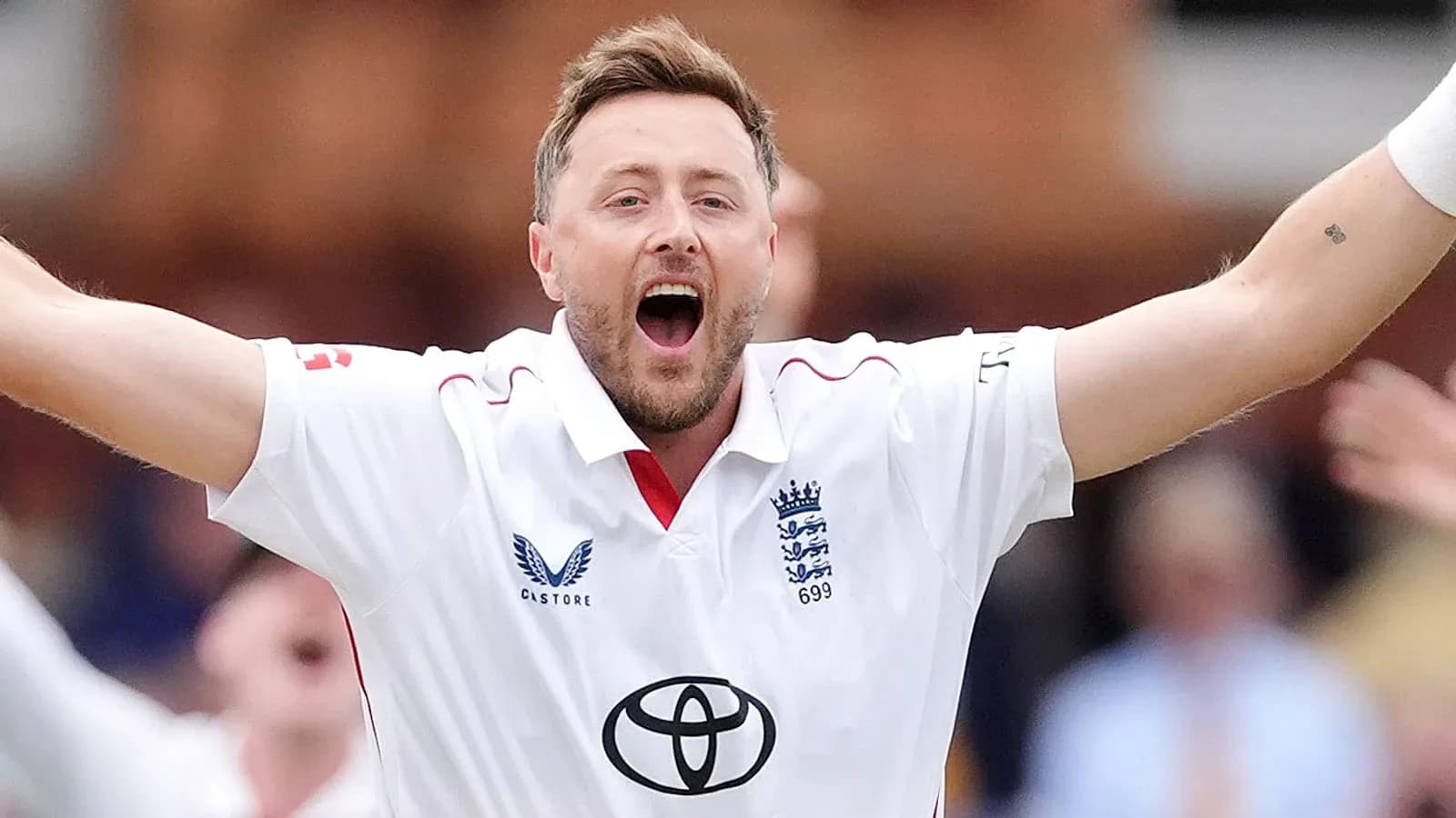 Cricketer celebrating a wicket in white jersey Cricketer celebrating a wicket in white jersey