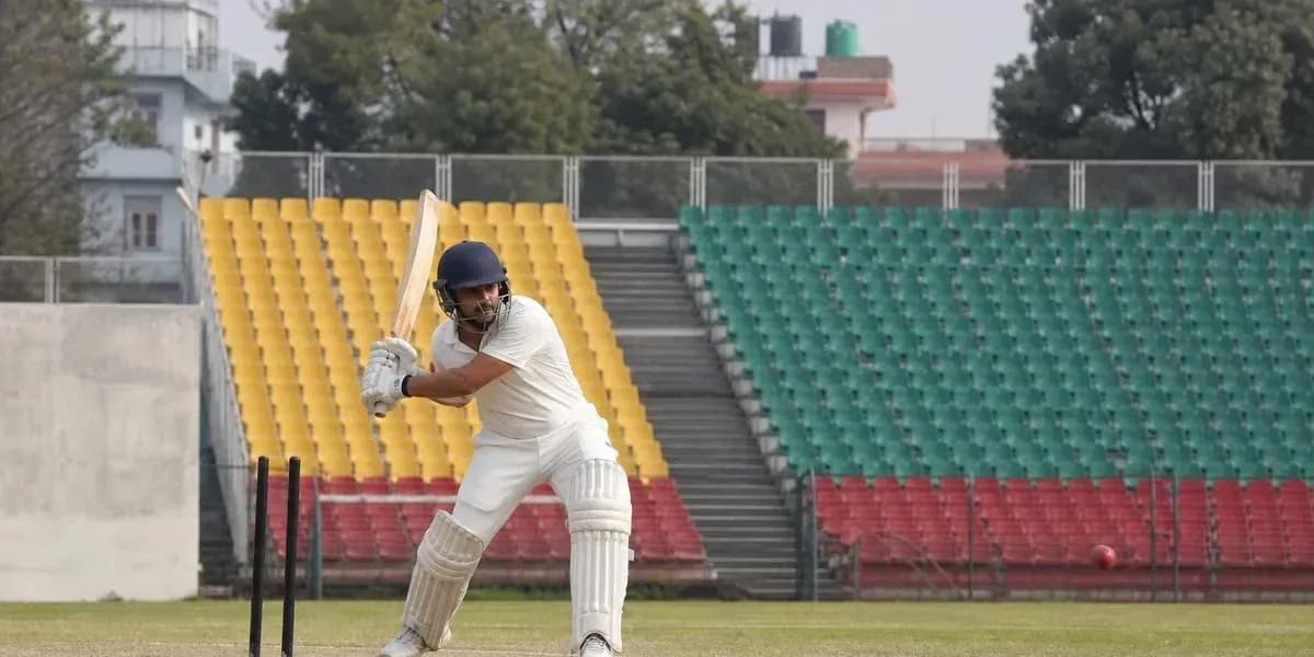 Cricketer batting on the field with empty stands Cricketer batting on the field with empty stands