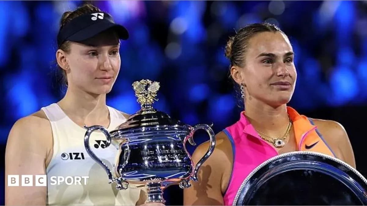 Two tennis players holding trophies after match Two tennis players holding trophies after match