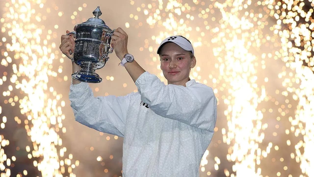 Player holding trophy with fireworks in background Player holding trophy with fireworks in background