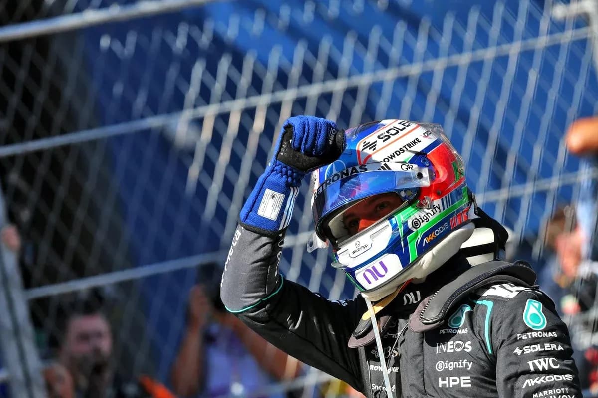 Driver celebrating with raised fist after race Driver celebrating with raised fist after race