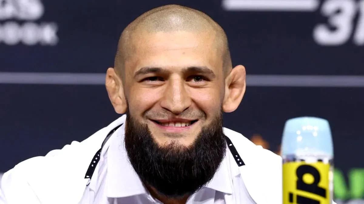 Fighter smiling at press conference with microphone Fighter smiling at press conference with microphone