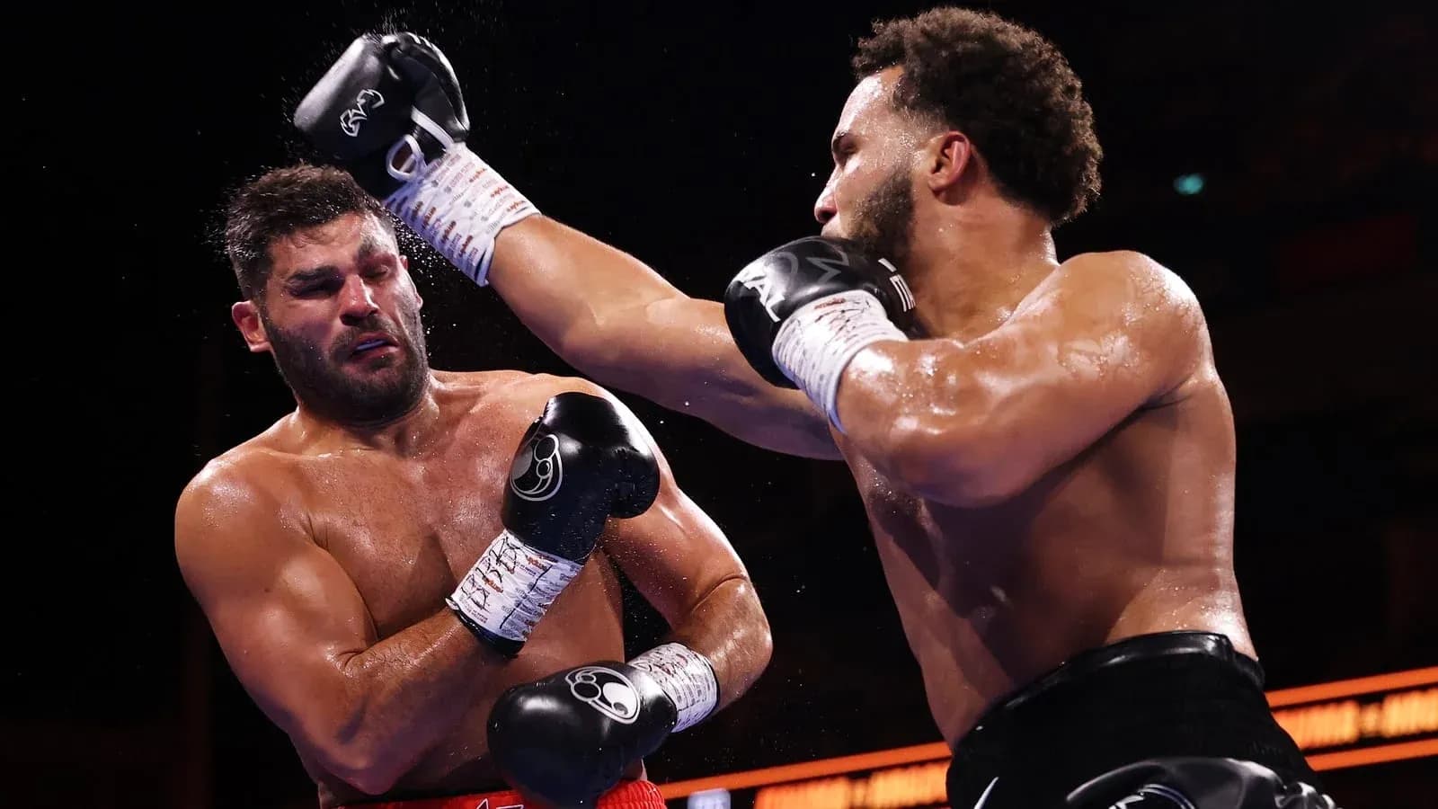 Boxers exchanging punches in the ring Boxers exchanging punches in the ring