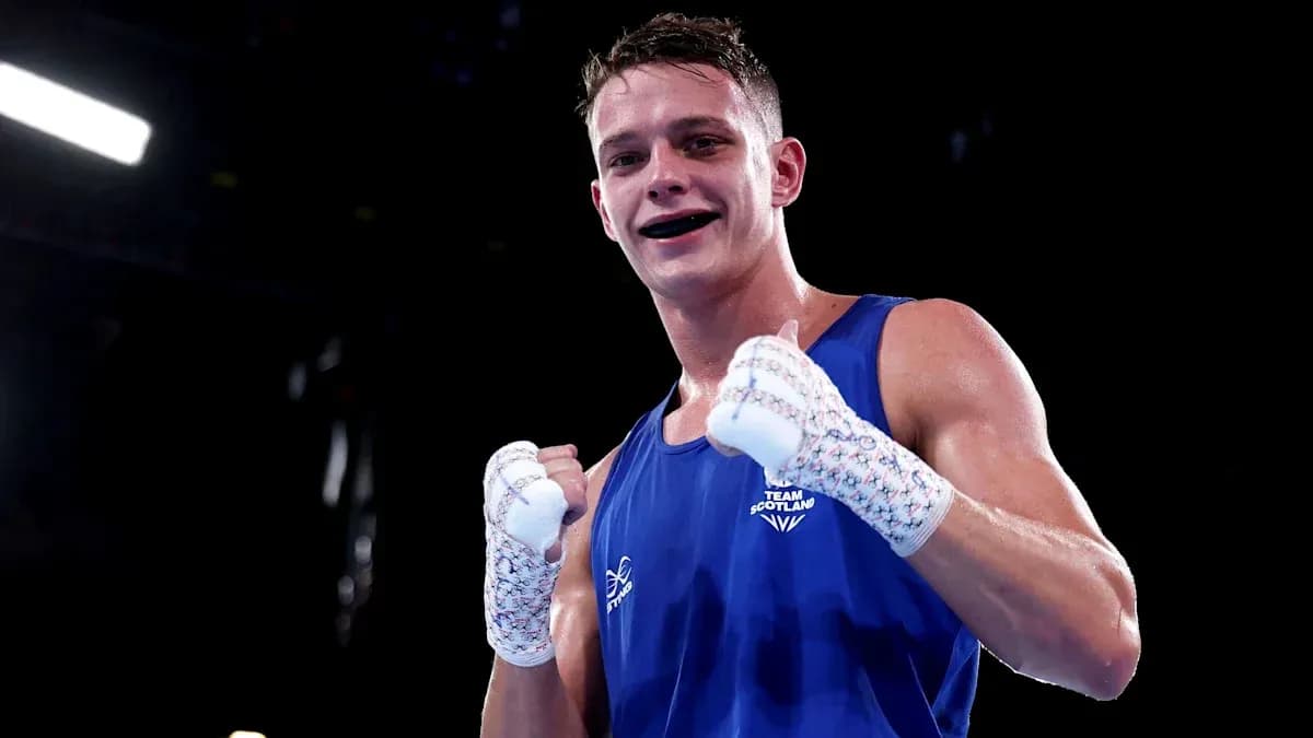 Boxer from Team Scotland celebrating victory in the ring Boxer from Team Scotland celebrating victory in the ring