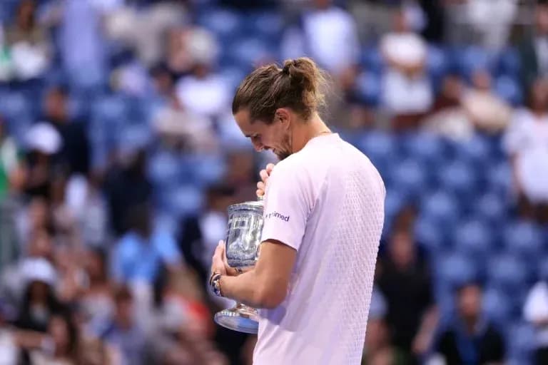 Player holding trophy after winning tournament Player holding trophy after winning tournament