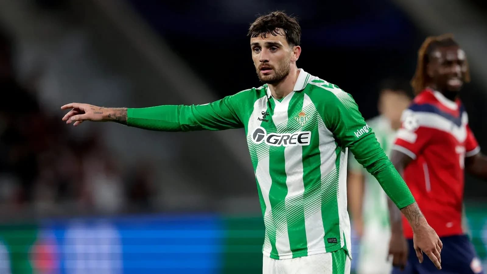 Player in green jersey signaling during match Player in green jersey signaling during match