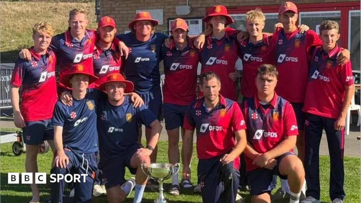 Cricket team posing with trophy in summer sun Cricket team posing with trophy in summer sun