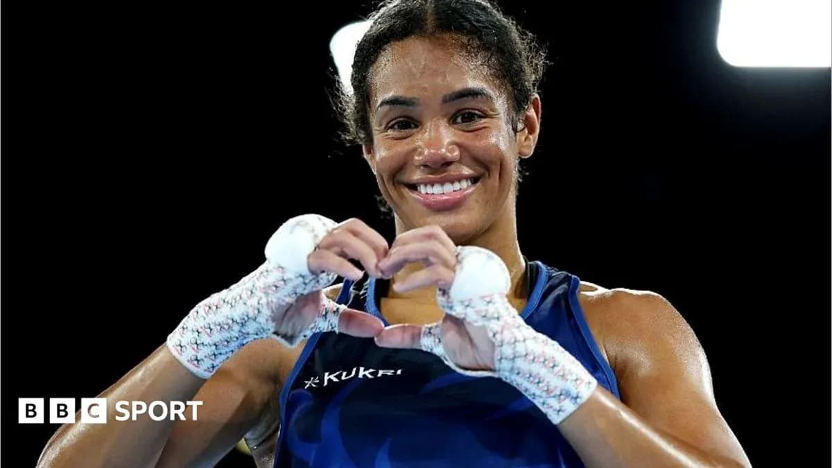 Female boxer making a heart shape with hands Female boxer making a heart shape with hands