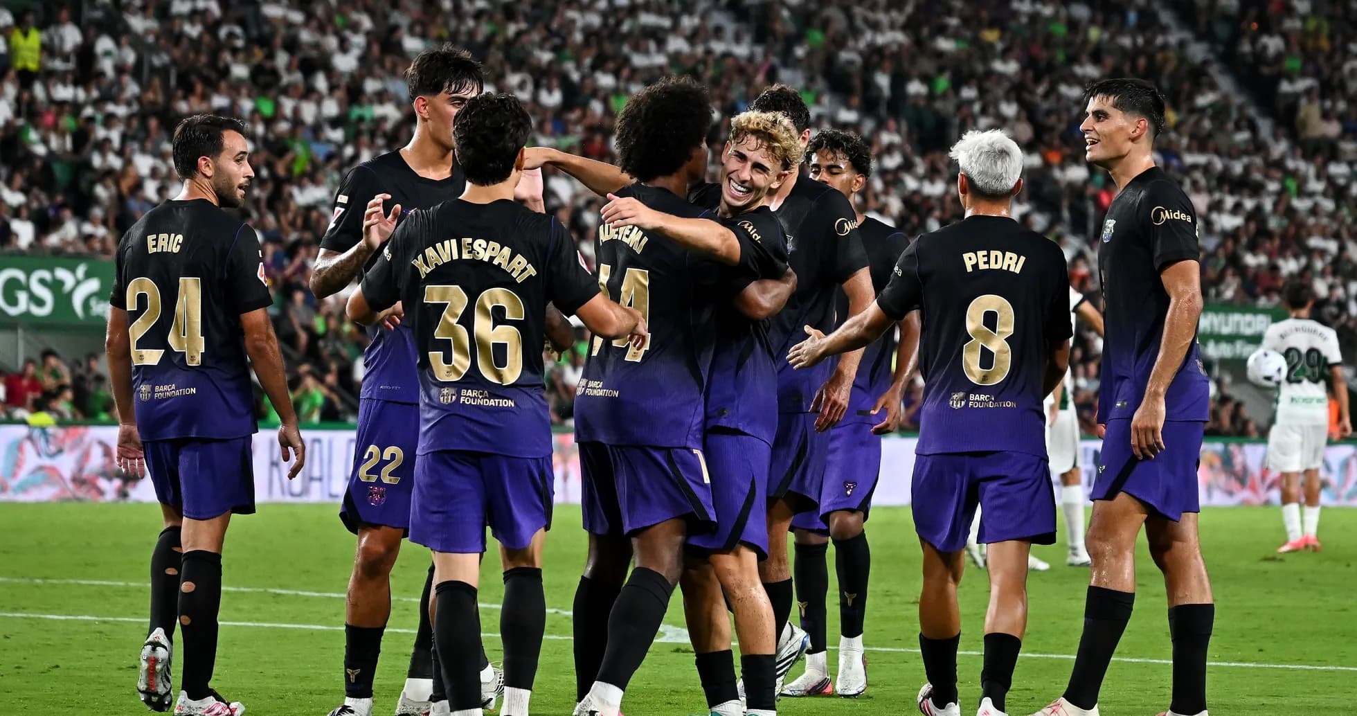 Players celebrating a goal during a match Players celebrating a goal during a match