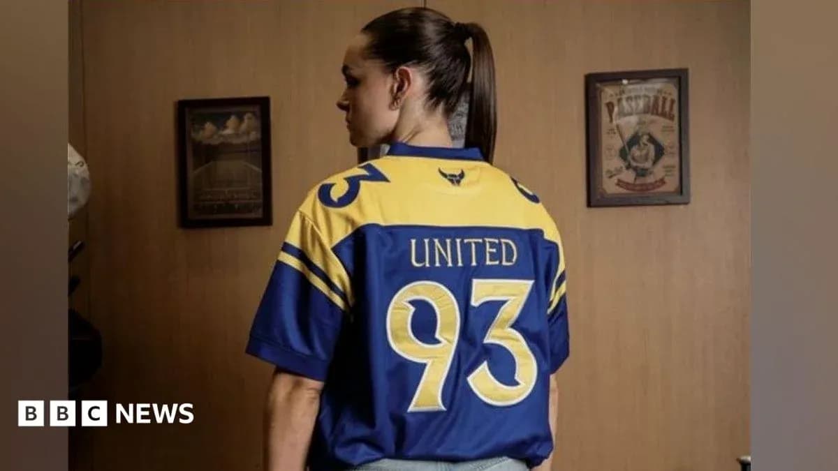Person wearing a blue and yellow jersey with '93' and 'UNITED' Person wearing a blue and yellow jersey with '93' and 'UNITED'